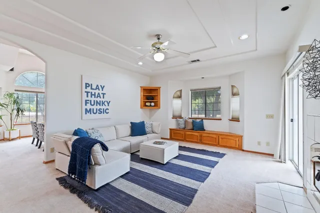a living room with furniture and a window