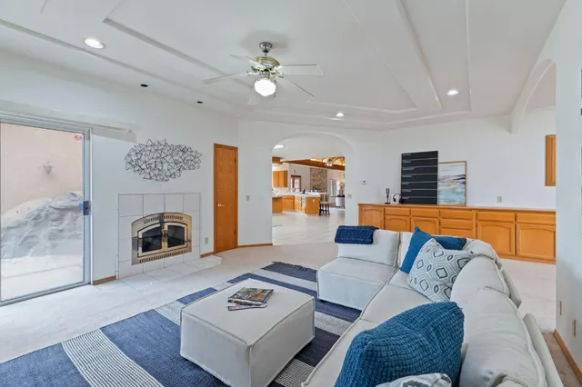 a living room with furniture and a large window