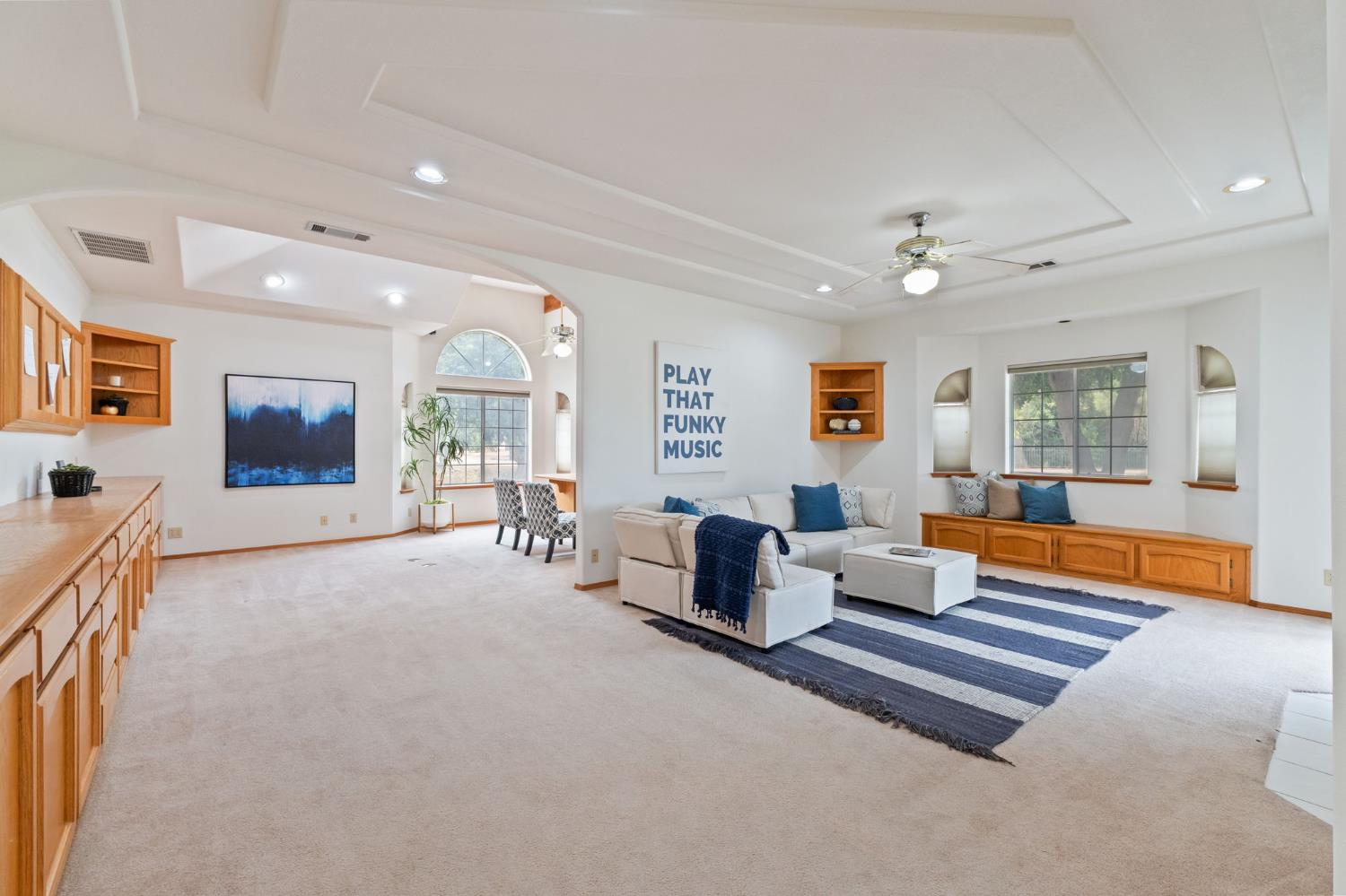 7357 East Dennett Avenue Fresno, CA 93737 - Photo 17 of 84 a living room with furniture and a table