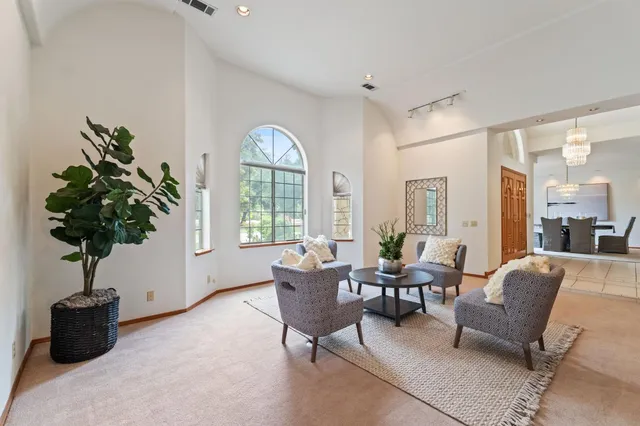 an empty room with a ceiling fan and closet area