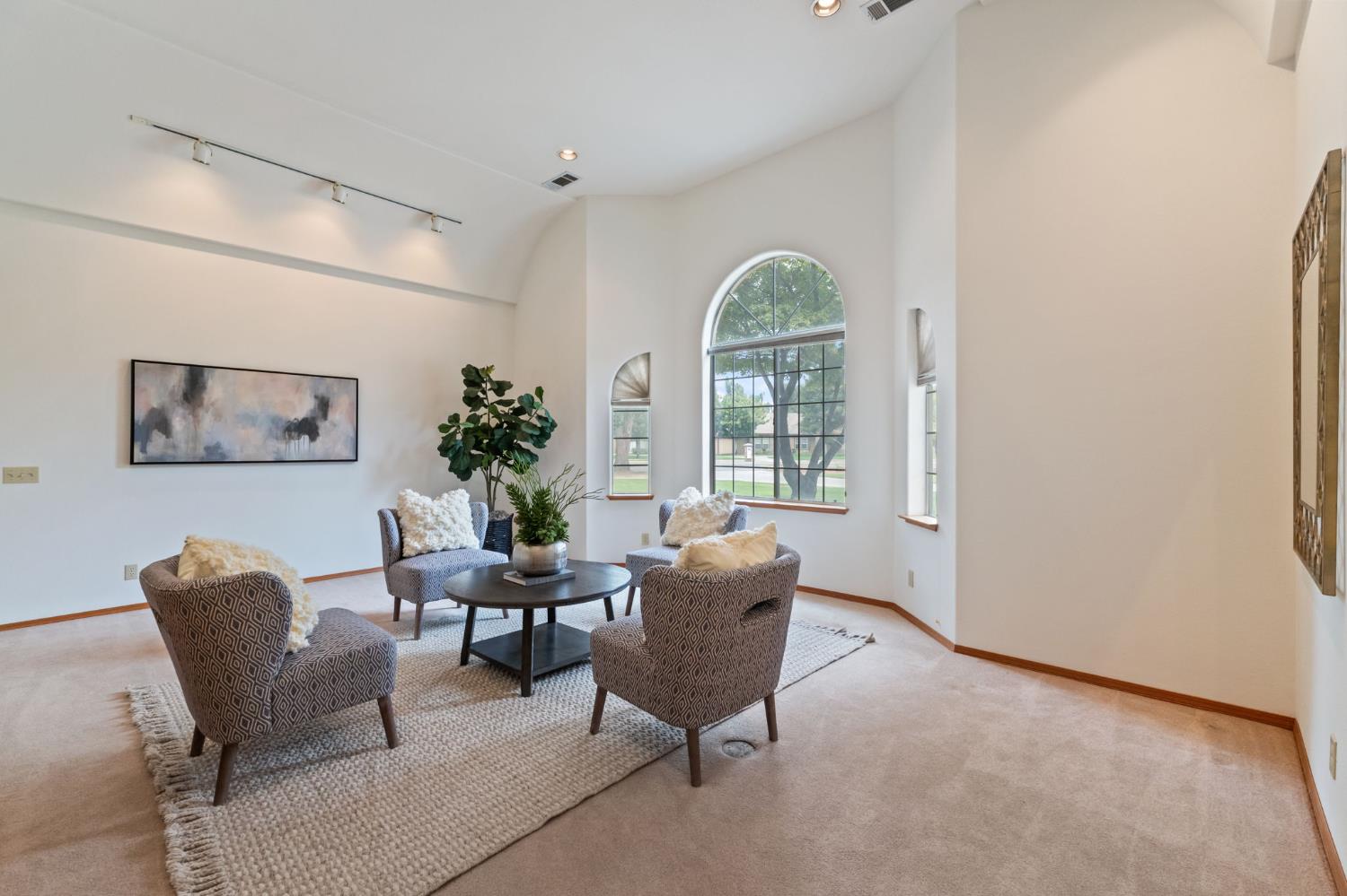 7357 East Dennett Avenue Fresno, CA 93737 - Photo 23 of 84 a living room with furniture and a window