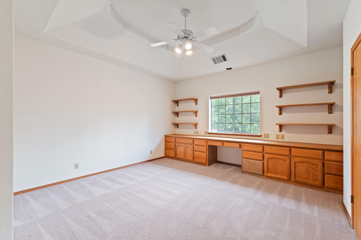 7357 East Dennett Avenue Fresno, CA 93737 - Photo 38 of 84 a large white room with a large window