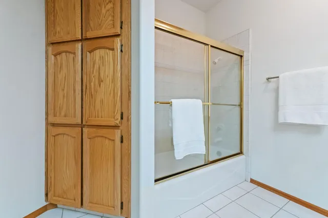 an aerial view of residential houses with outdoor space and river