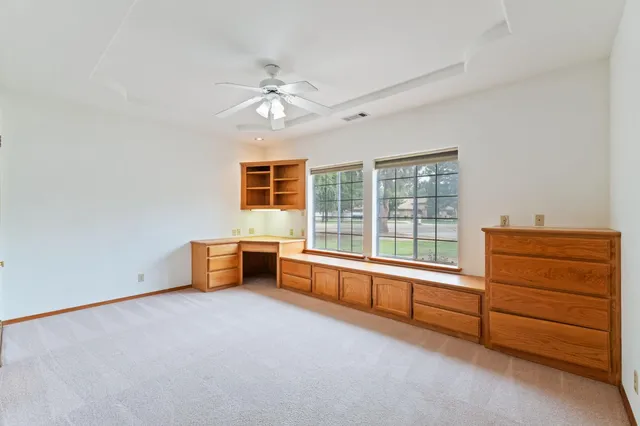 an aerial view of a residential houses with outdoor space