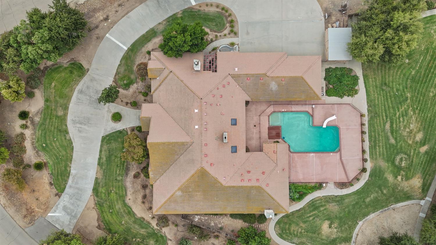 7357 East Dennett Avenue Fresno, CA 93737 - Photo 55 of 84 an aerial view of a house with a garden