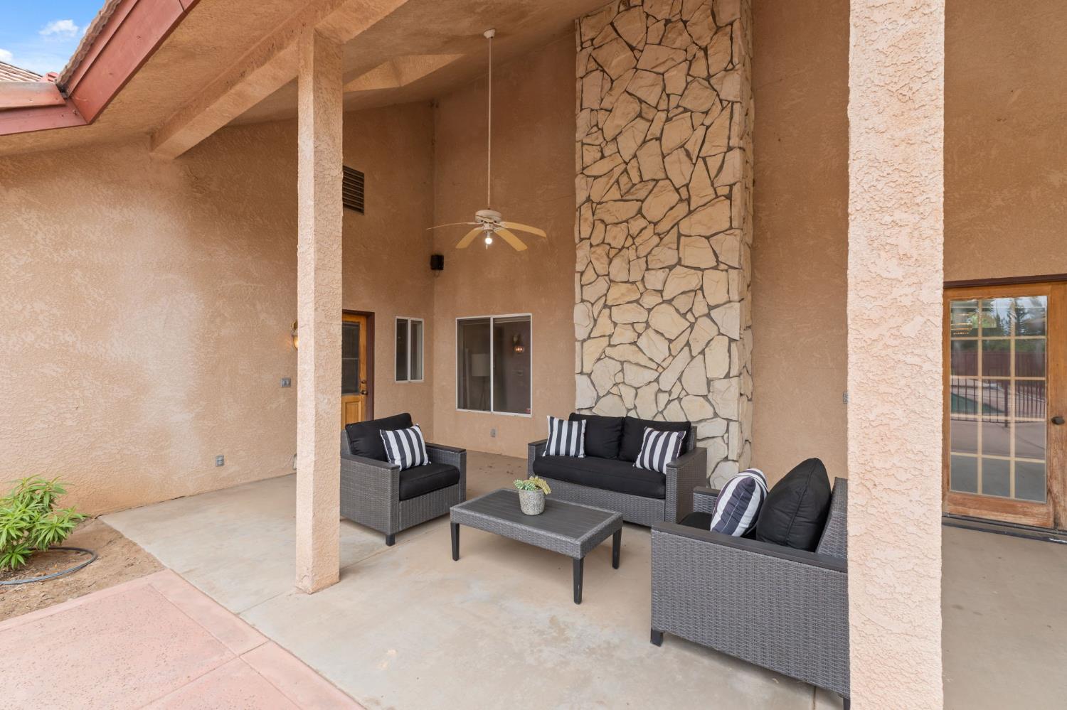 7357 East Dennett Avenue Fresno, CA 93737 - Photo 63 of 84 a outdoor living space with furniture and a potted plant