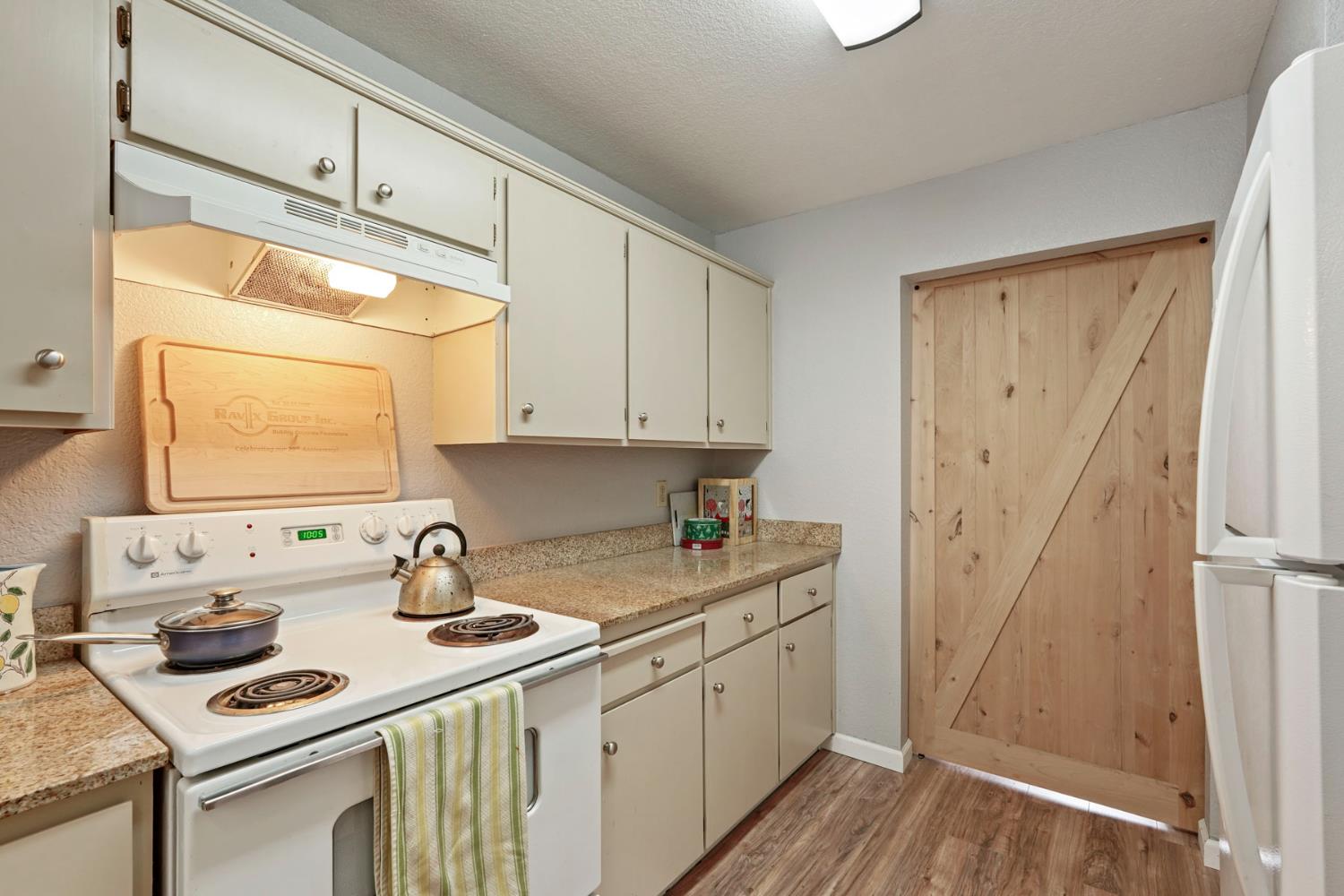 2401 Eilers Lane, Unit 304 Lodi, CA 95242 - Photo 9 of 21 a kitchen with a sink stove and cabinets