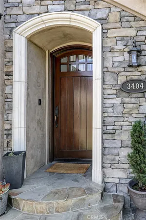 a view of a dining room with furniture wooden floor and chandelier