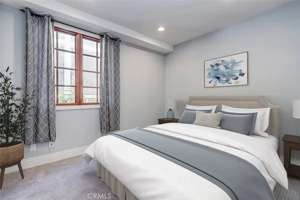a view of a room with wooden floor and windows
