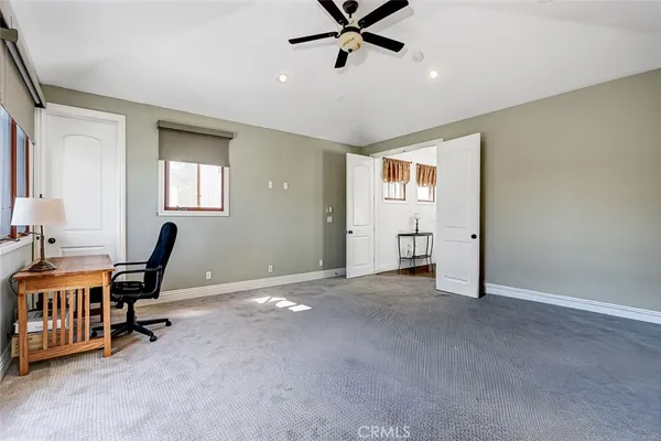 a bedroom with a bed and a night stand