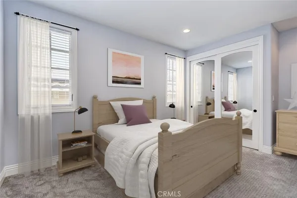 an empty room with windows and closet