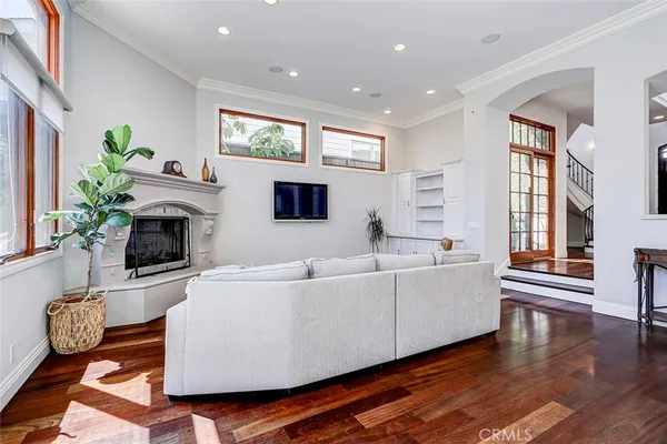 a kitchen with stainless steel appliances white cabinets and a window
