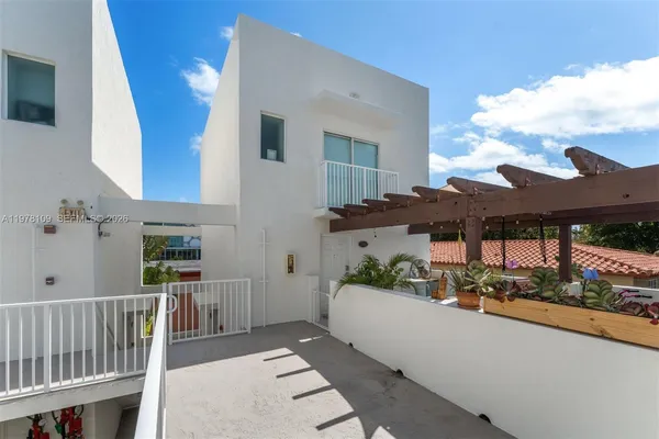 a balcony view with a seating space