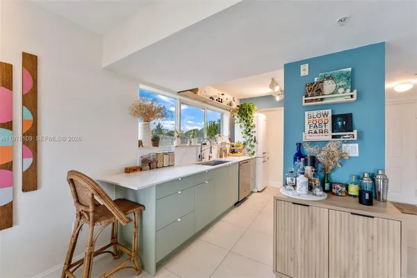 a kitchen with stainless steel appliances a microwave and cabinets