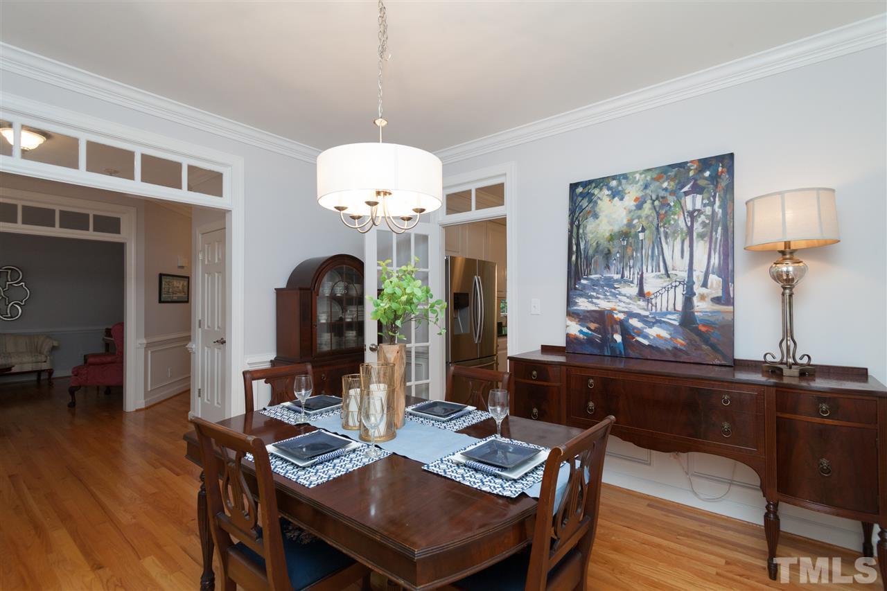 4124 Ridgebrook Bluffs Drive Raleigh, NC 27603 - Photo 4 of 24 Sizeable and sunlit dining room is elegantly displayed upon entry.