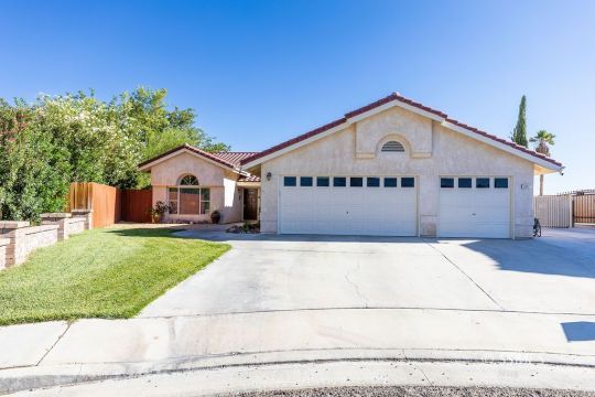 1217 Flora Way Ridgecrest, CA 93555 - Photo 1 of 39 a view of house with garden