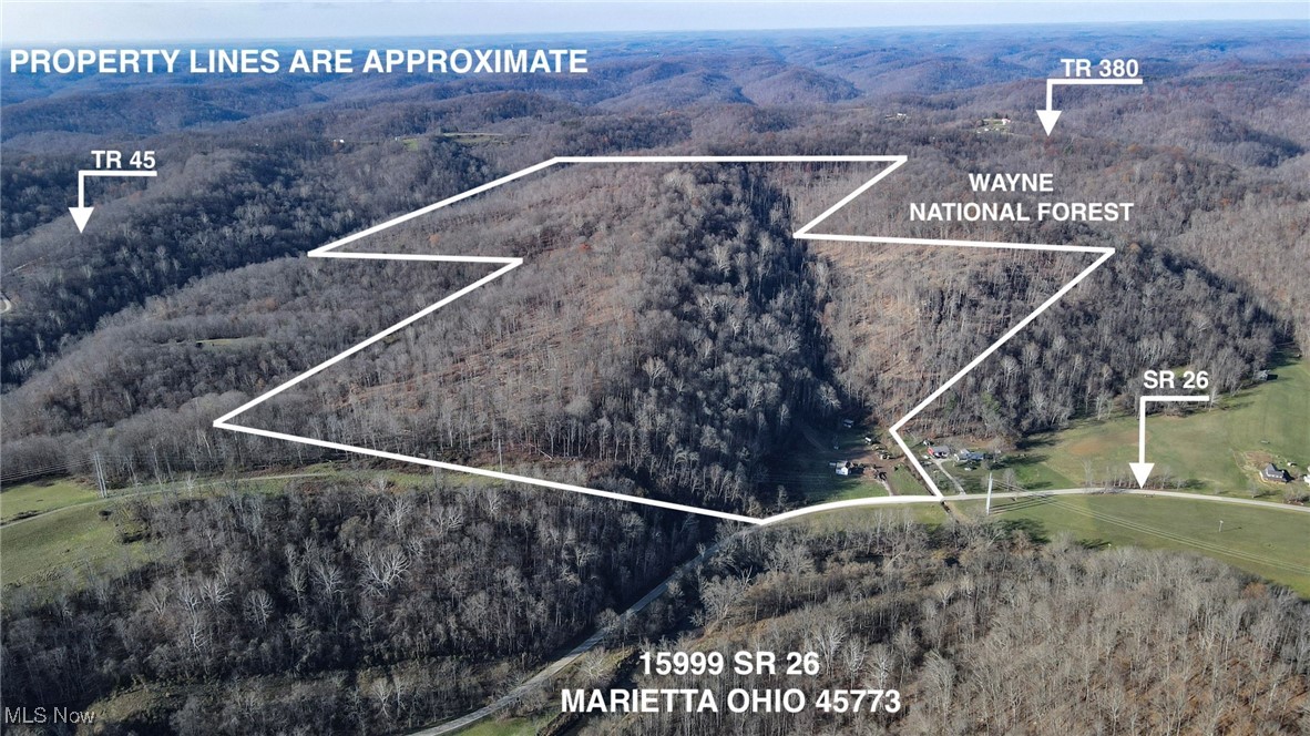 15999 State Route 26 Reno, OH 45773 - Photo 1 of 18 Aerial overview of property's location with a forest, property parcel outlined, and a mountainous background
