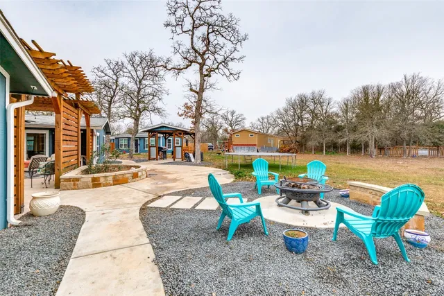 a view of house with outdoor space and sitting area