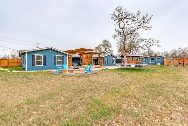 an aerial view of a house with outdoor space