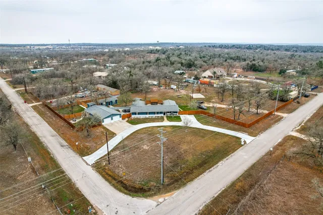 a kitchen with a refrigerator and a sink