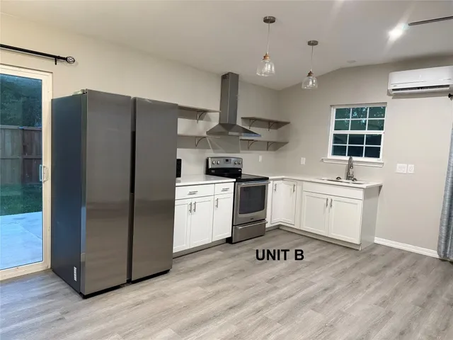 a bathroom with a toilet and shower