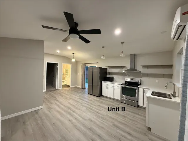 a bathroom with a toilet a sink and a mirror