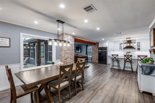 a dining room with furniture and window