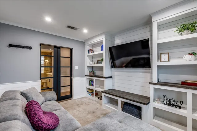 a bedroom with a large bed and a couch