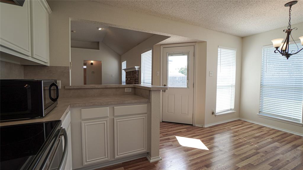 137 Magnolia Lane Rockwall, TX 75032 - Photo 11 of 28 a spacious bathroom with a granite countertop sink and a mirror