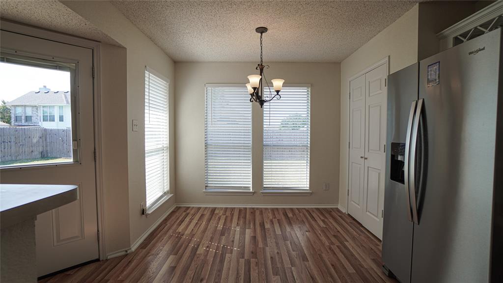 137 Magnolia Lane Rockwall, TX 75032 - Photo 12 of 28 a view of a room with wooden floor and large window