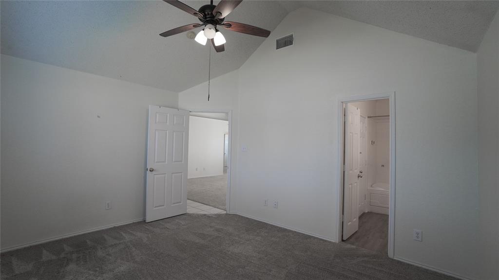 137 Magnolia Lane Rockwall, TX 75032 - Photo 15 of 28 an empty room with a ceiling fan and a fan