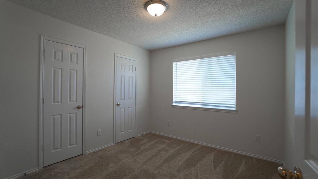 137 Magnolia Lane Rockwall, TX 75032 - Photo 20 of 28 an empty room with windows and closet