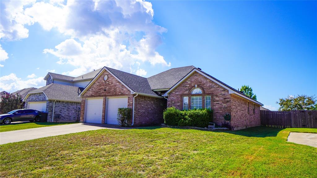137 Magnolia Lane Rockwall, TX 75032 - Photo 2 of 28 a front view of a house with garden