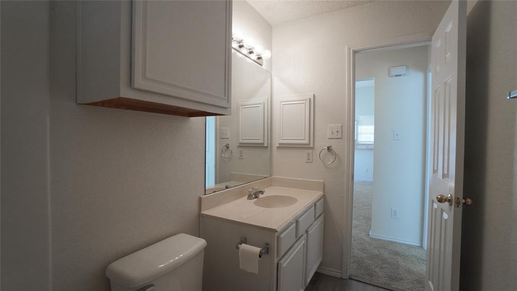 137 Magnolia Lane Rockwall, TX 75032 - Photo 23 of 28 a bathroom with a sink a toilet and shower