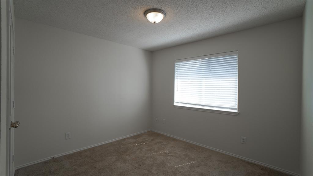 137 Magnolia Lane Rockwall, TX 75032 - Photo 24 of 28 an empty room with a window