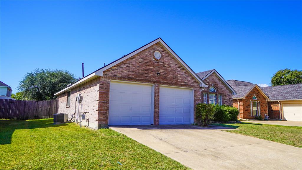 137 Magnolia Lane Rockwall, TX 75032 - Photo 3 of 28 a view of backyard of house with wooden fence