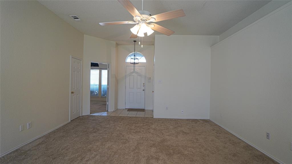 137 Magnolia Lane Rockwall, TX 75032 - Photo 5 of 28 wooden floor in an empty room with a window