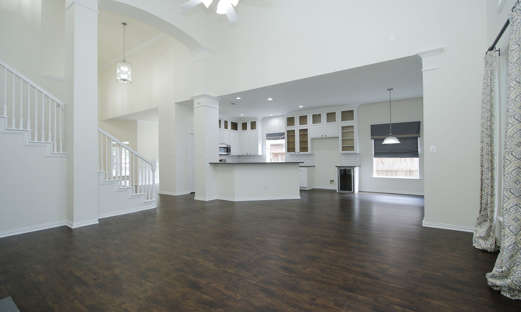 1210 Berwick Manor Court Spring, TX 77379 - Photo 20 of 50 a view of kitchen and hall with wooden floor and windows