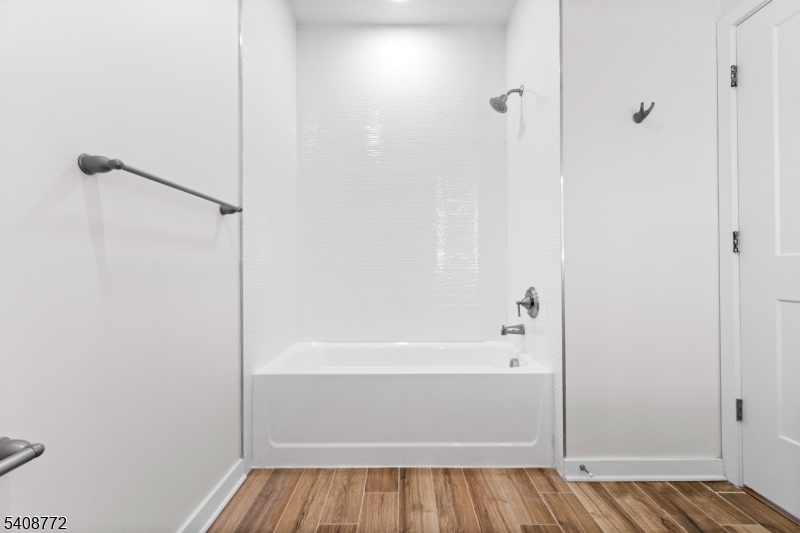 321 East 3rd Street, Unit 210 Plainfield, NJ 07060 - Photo 17 of 43 a bathroom with a bathtub