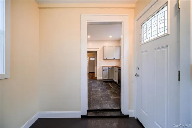 a view of an empty room with windows