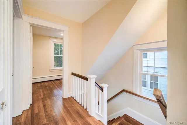 a view of a room that has a bed in it