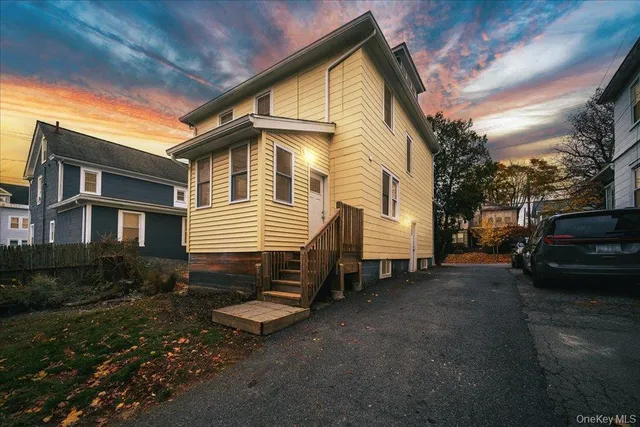 a front view of a house with a yard