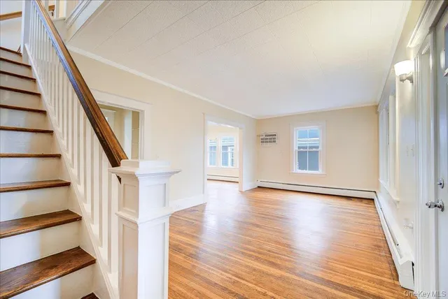 a view of a porch with wooden floor and outdoor space