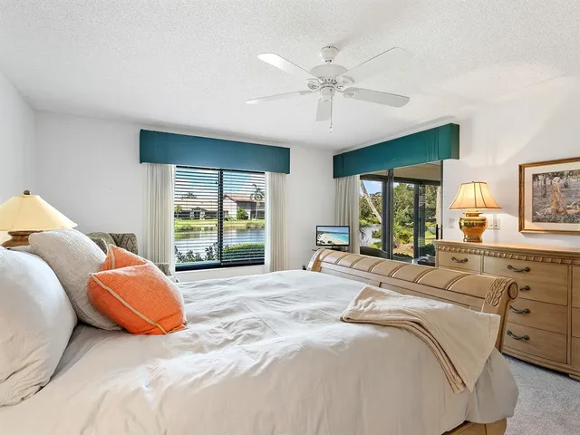 a living room with couch and a large window
