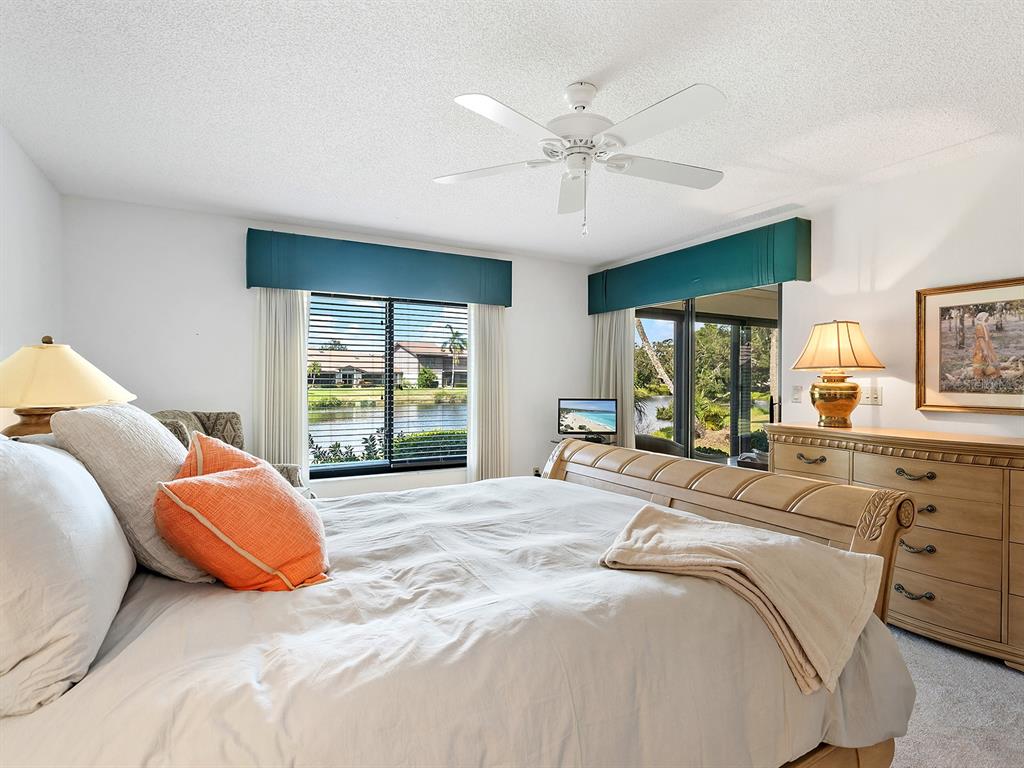 6094 Wilshire Boulevard, Unit 8 Sarasota, FL 34233 - Photo 21 of 42 a bedroom with a bed and window
