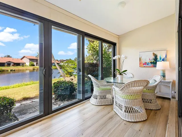 a front view of a house with a garden and plants