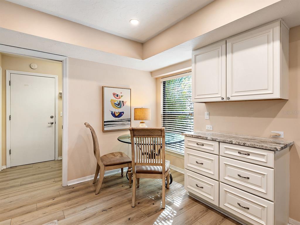 6094 Wilshire Boulevard, Unit 8 Sarasota, FL 34233 - Photo 27 of 42 a view of a workspace with furniture and a window