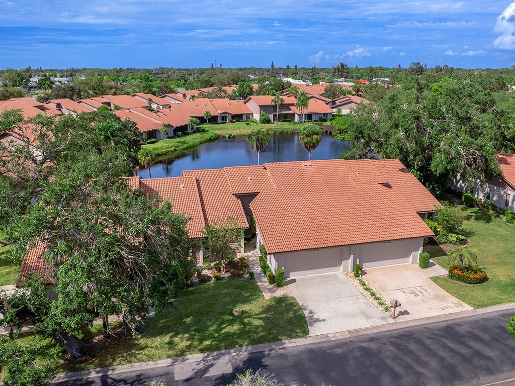 6094 Wilshire Boulevard, Unit 8 Sarasota, FL 34233 - Photo 33 of 42 an aerial view of a house with a garden