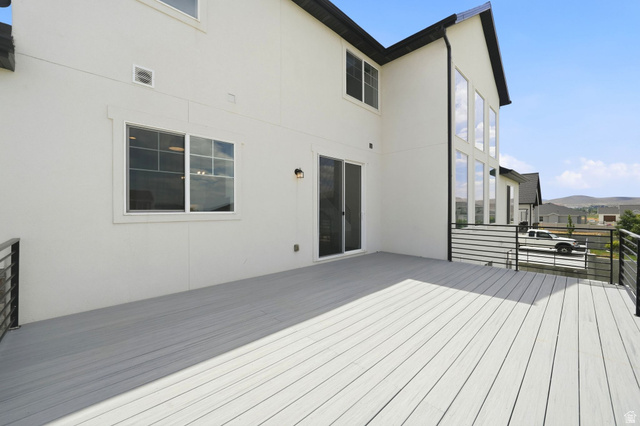 1002 West Temple Rim Lane Payson, UT 84651 - Photo 62 of 68 Spacious deck featuring composite decking and black metal railings