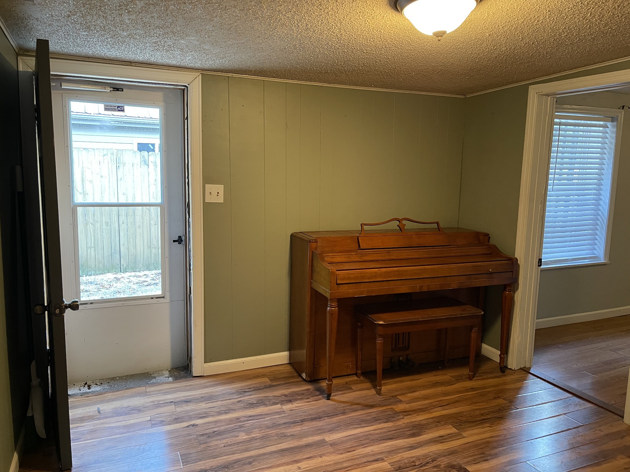 312 Gentry Street Tullahoma, TN 37388 - Photo 11 of 29 a room with a door and wooden floor